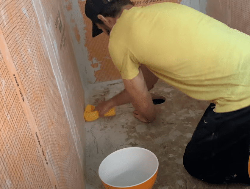 Remove Dust from the Subfloor with a Wet Sponge