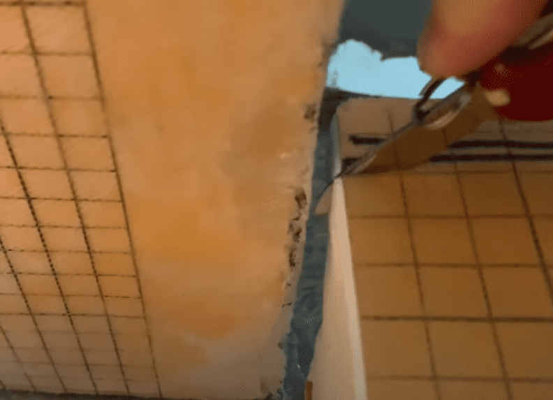 Cut your Kerdi Shower Curb (as needed) using a utility knife of Hack Saw