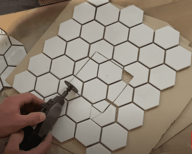 Use a Dremel Tool with a Diamond Blade to Cut the Tiles around the Shower Drain
