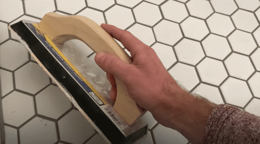Apply Grout to grout lines by holding your grout float at a 45 degree angle