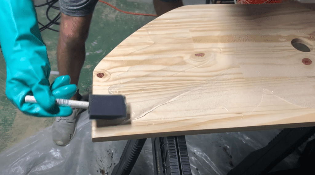 Apply the epoxy coating to the floating vanity using a foam brush.  