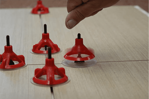Two-in-one tile spacer and leveling system