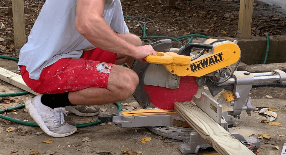Cut along the gate frame marked lines using a miter saw