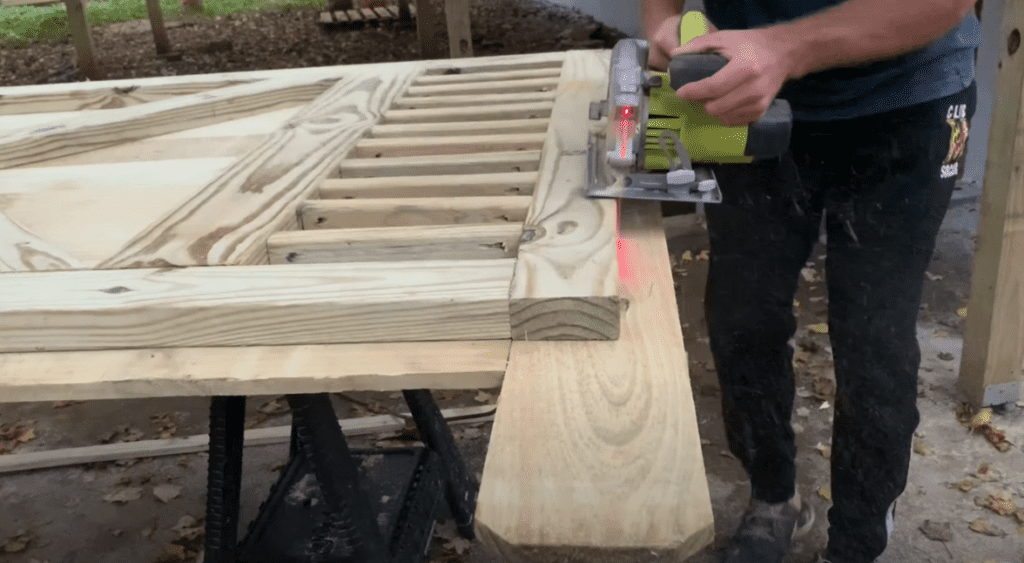 Trim any excess gate pickets with a circular saw