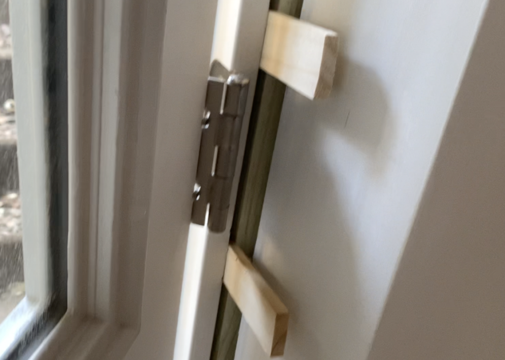 Place shims between door jamb and framing as needed