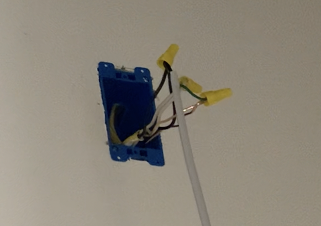 Connect the LED Bathroom Mirror wires to the incoming power supply wire with wire nuts and electrical tape