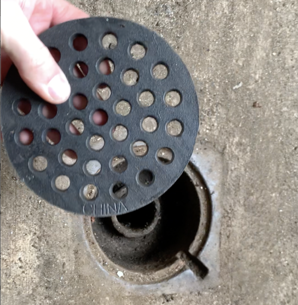 Re-install the basement egress drain grate
