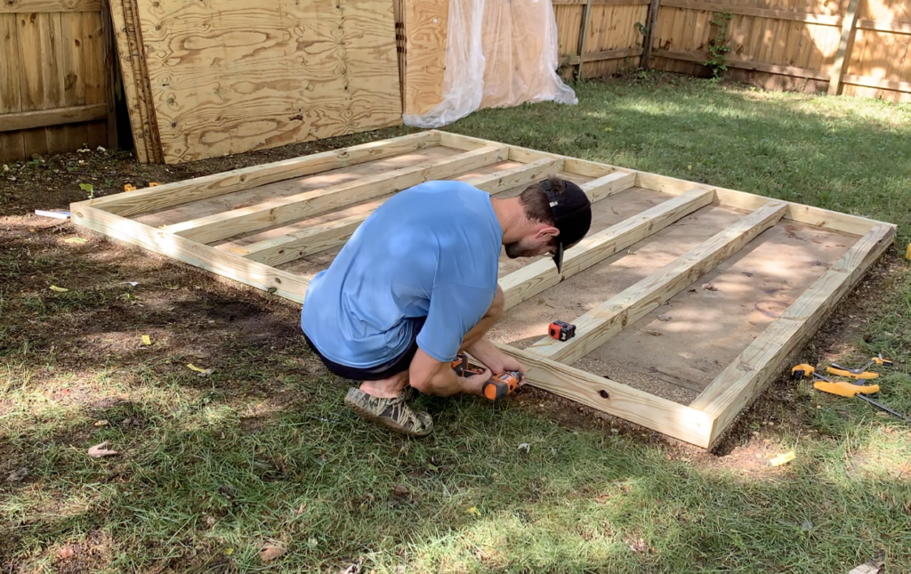 Attach the 2"x4" end caps to the 4"x4" shed base floor joists 