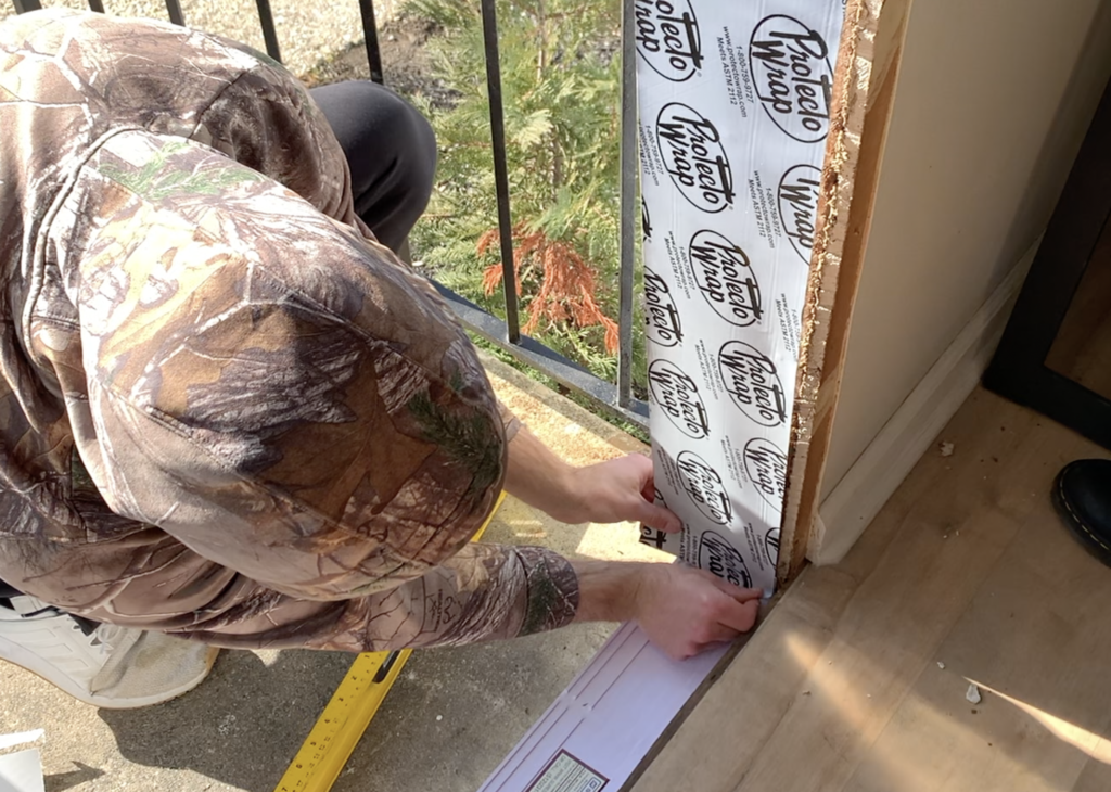 Install Flashing on the Door frame and Overlap the Sill Plate