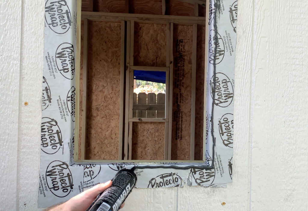 Apply sealant around the entire perimeter of the shed window as shown