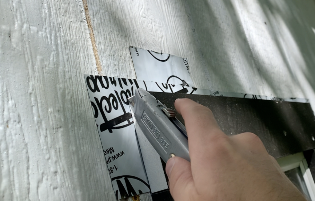 Trim off any excess flashing around the window trim casing with a utility knife. 
