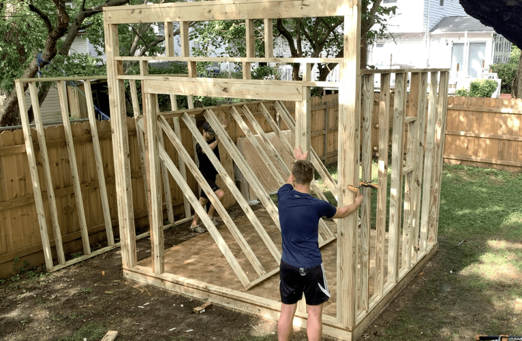 Lift the Shed's side walls into place