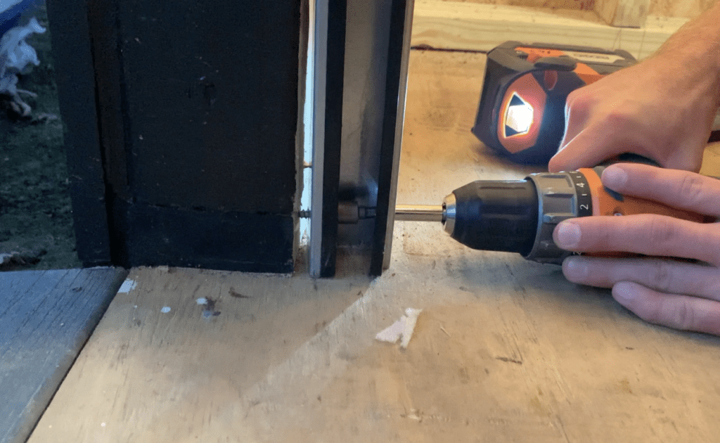 Install Fasteners at the Bottom of the Roll Up Door Guides 