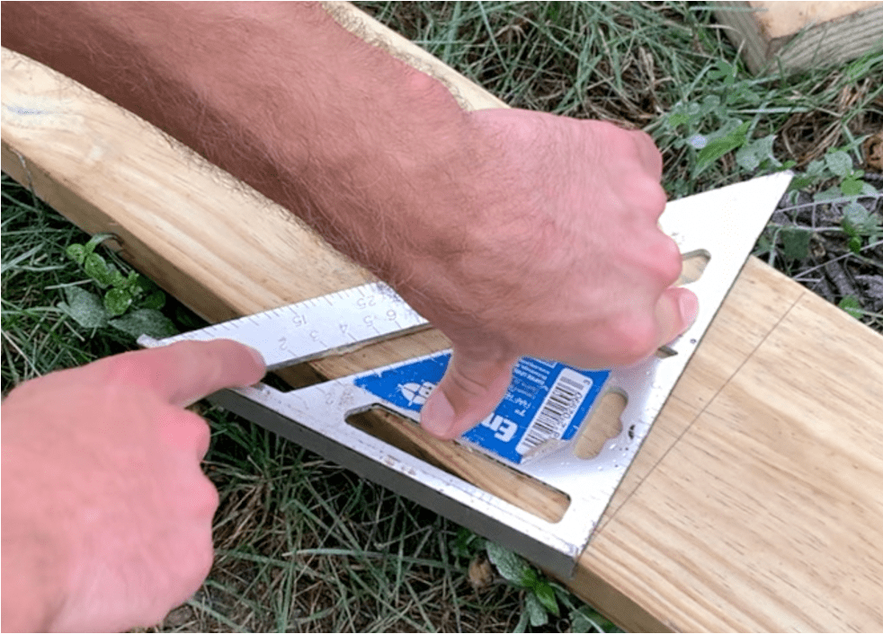 Rotate the carpenters square to the "2" (or as needed for your roof pitch)