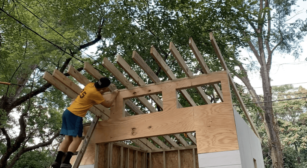 Position lean to shed roof rafters in place
