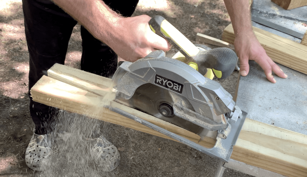 Cut the angle on the bottom of the shed ramp joist using a circular saw as shown