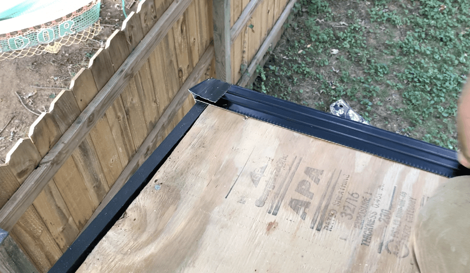 Consider making a 90 degree angled cut on the drip edge that will extend up on the rake side of the shed roof. 
