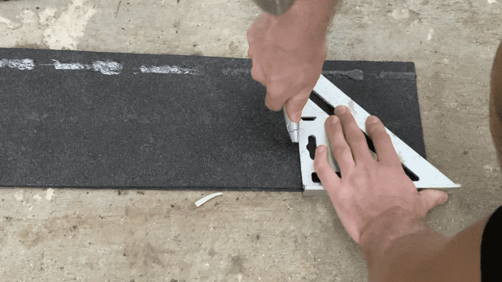 Cut approximately 4" off the length of the first starter strip using a utility knife