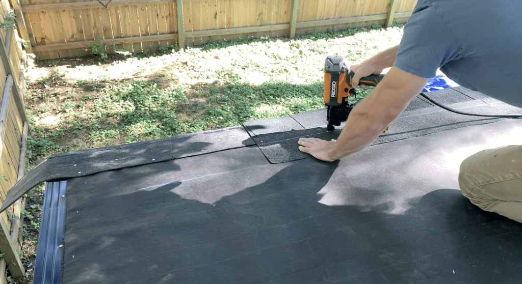 Fasten the shingles to the shed using roofing nails as shown