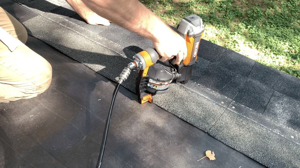 Nail the second course of shed shingles in place. Ensure that the back line of the shingles is maintained. 