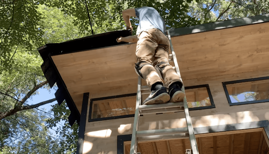 trim off all of the excess shingle with a utility knife such that the shingles are flush with the shed's front fascia board