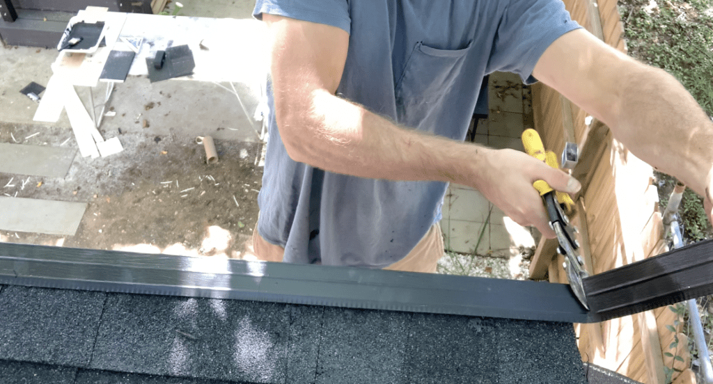Trim the shed roof ridge flashing as needed