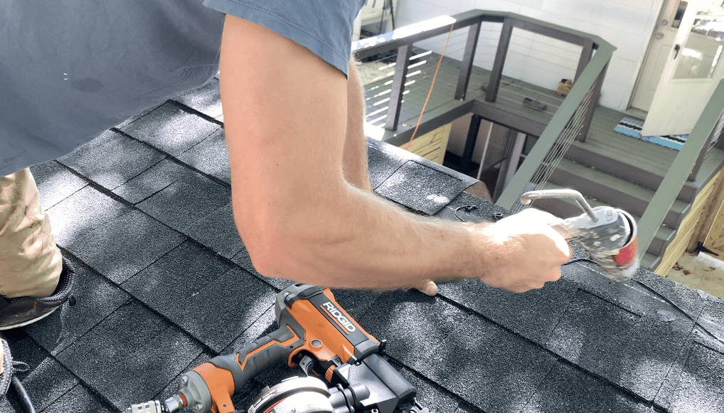 Consider applying a bit of roofing mastic below the final row of shingles - to aid in adhesion. 