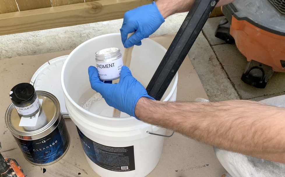 Mix 4 ounces of pigment power per each gallon of epoxy resin