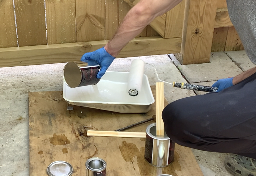 After mixing the urethane top coat components, pour the coating into a paint tray.