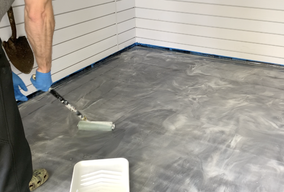 Apply the urethane top coating over the epoxy floor coating using a 3/8" nap roller. 