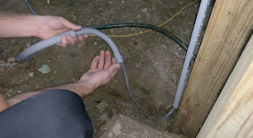 Run the electrical cable through the PVC conduit in an incremental fashion