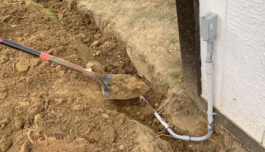 Backfill the electrical conduit trench