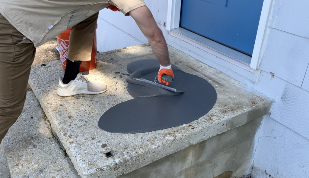 Apply the concrete resurfacing product with a hand trowel