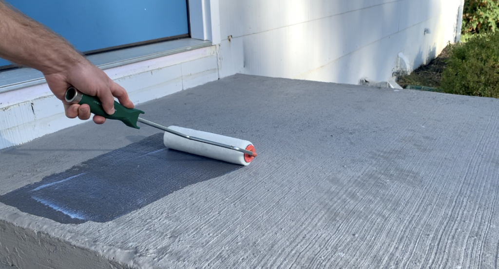 Apply the concrete sealer using a nap roller