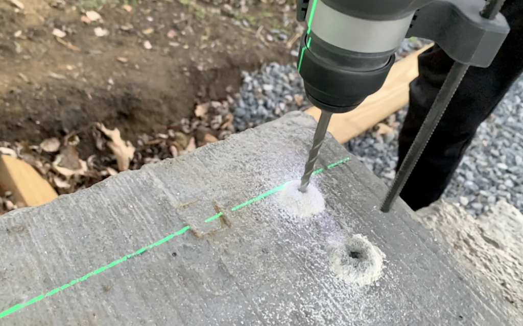 Pre-drill holes into the concrete surface at the marked locations