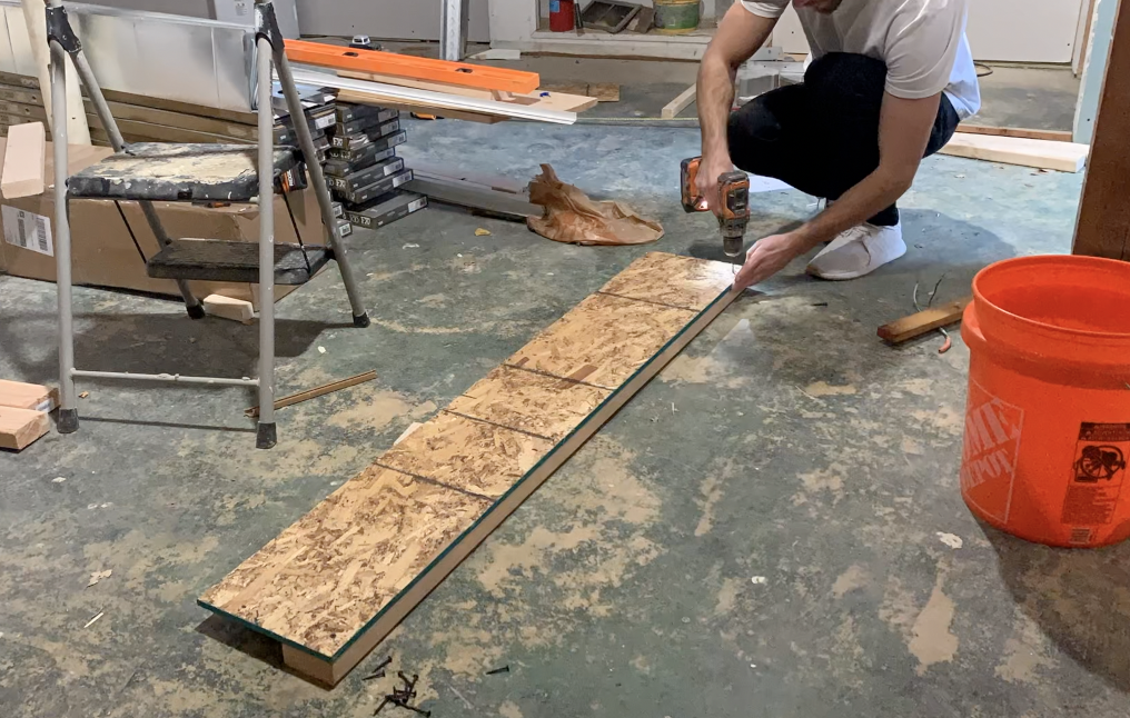 Attach a 2"x4" "Mounting stud" to the bottom of the OSB