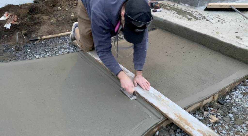 Use a board as a straight edge for the Concrete grooving tool