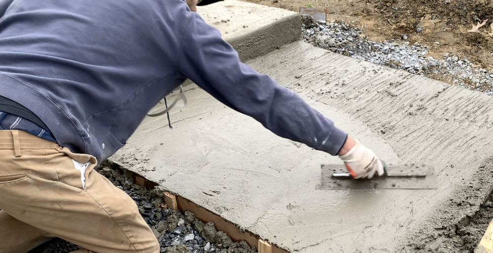 Finish the surface of the concrete using a hand/finishing trowel