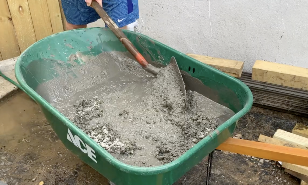 Mix the Concrete in the Wheelbarrow Using a Shovel