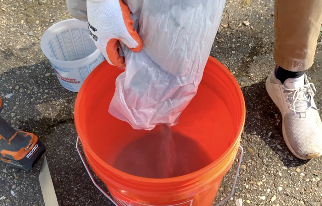 Add concrete to the bucket + Water