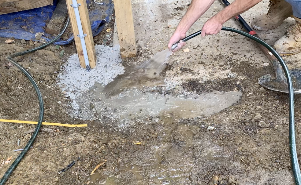 Add water directly to the dry concrete mix - mix up with a shovel as needed