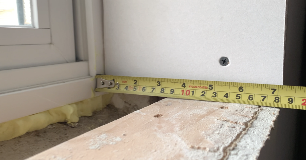 Measure the depth for the basement window sill. 